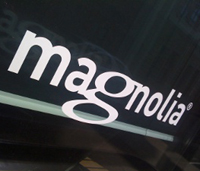 The Magnolia International logo on a building